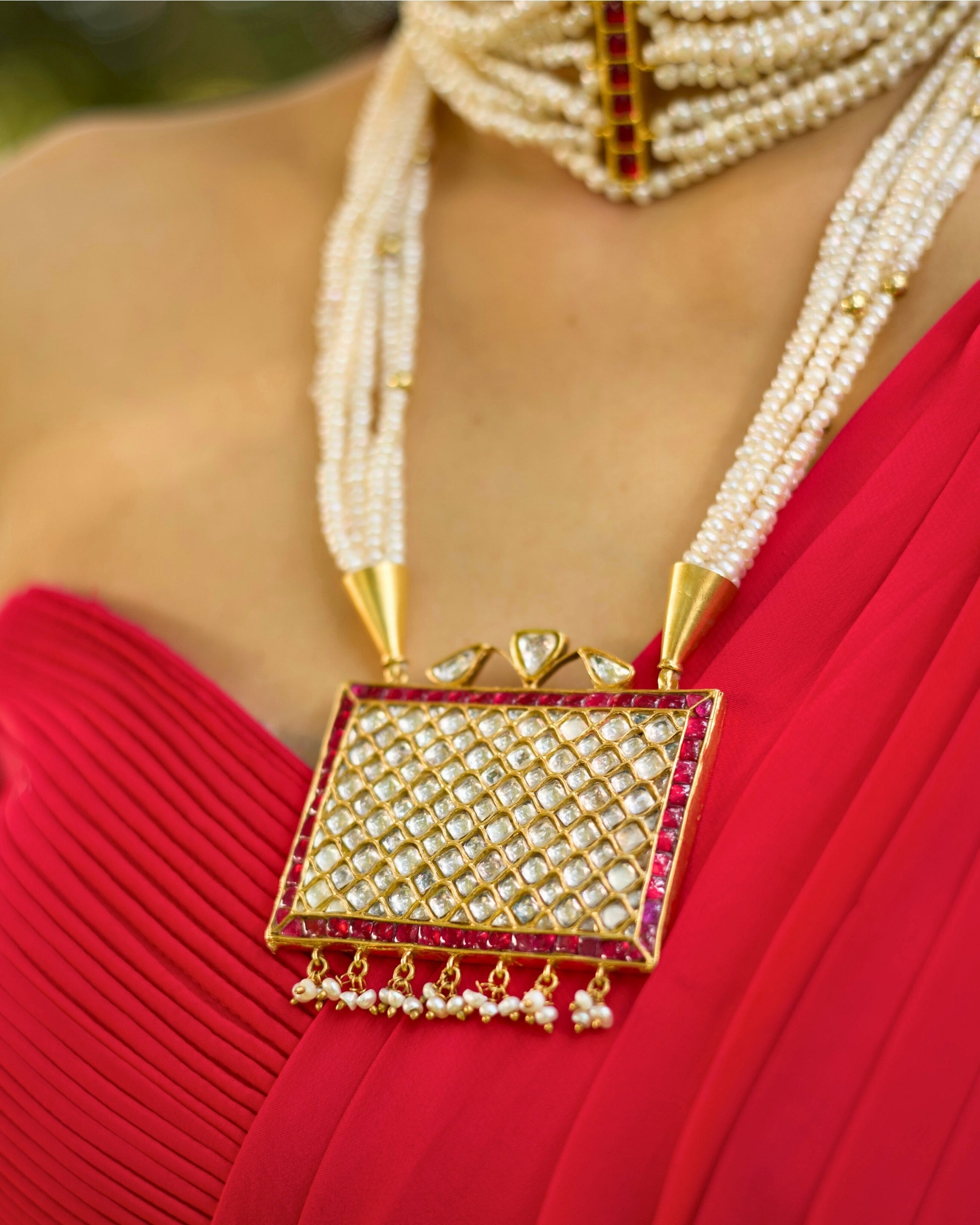 Statement pearl necklace with ruby border grid pendant and gold-polished silver detailing