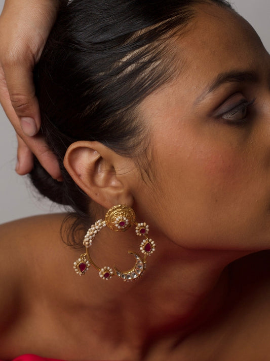 Close-up of model wearing Naksa's Chaandni Raat Hoops – gold-plated 92.5 silver earrings with kundan stones, pearls, and crescent moon design.