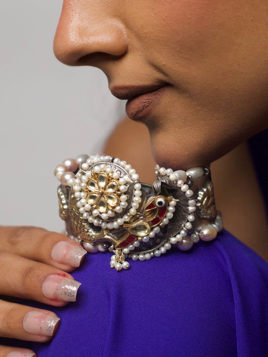 Pure 92.5 silver statement cuff with red enamel fish, kundan floral center, and pearl detailing – Eyes of the Sea Cuff by Naksa